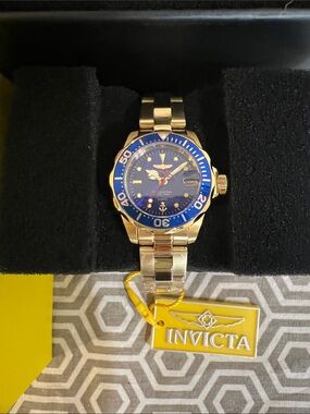 Invicta Gold Tone Watch with Blue Dial and Bezel